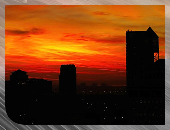 The Mississauga Downtown Core featuring the City Hall Clock Tower at sunset.