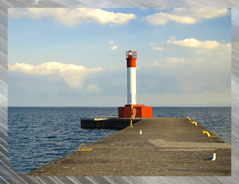 The lighthouse, a recognized landmark of the Oakville waterfront, offers an inviting stroll to residents and visitors alike.