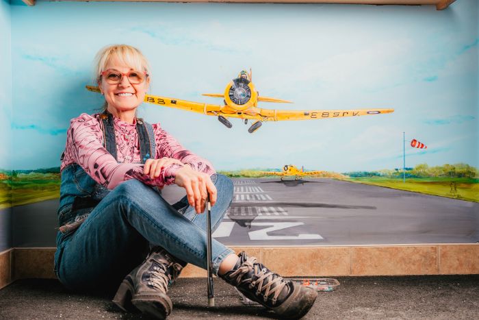 Stella Jurgen hand-painted a Harvard taking off from the runway in front of the Skyway Café in the Tillsonburg Regional Airport lounge.