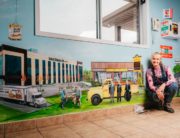Stella Jurgen has hand-painted store-fronts of local businesses in a mural at the Tillsonburg Regional Airport.