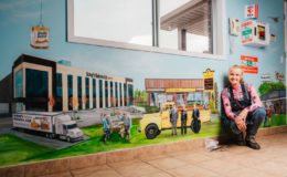 Stella Jurgen has hand-painted store-fronts of local businesses in a mural at the Tillsonburg Regional Airport.