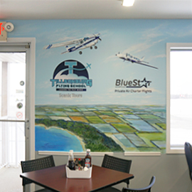 Tillsonburg Flying School and BlueStar Air Services hand-painted planes by Stella Jurgen of 17 Designs on the Tillsonburg Regional Airport mural.